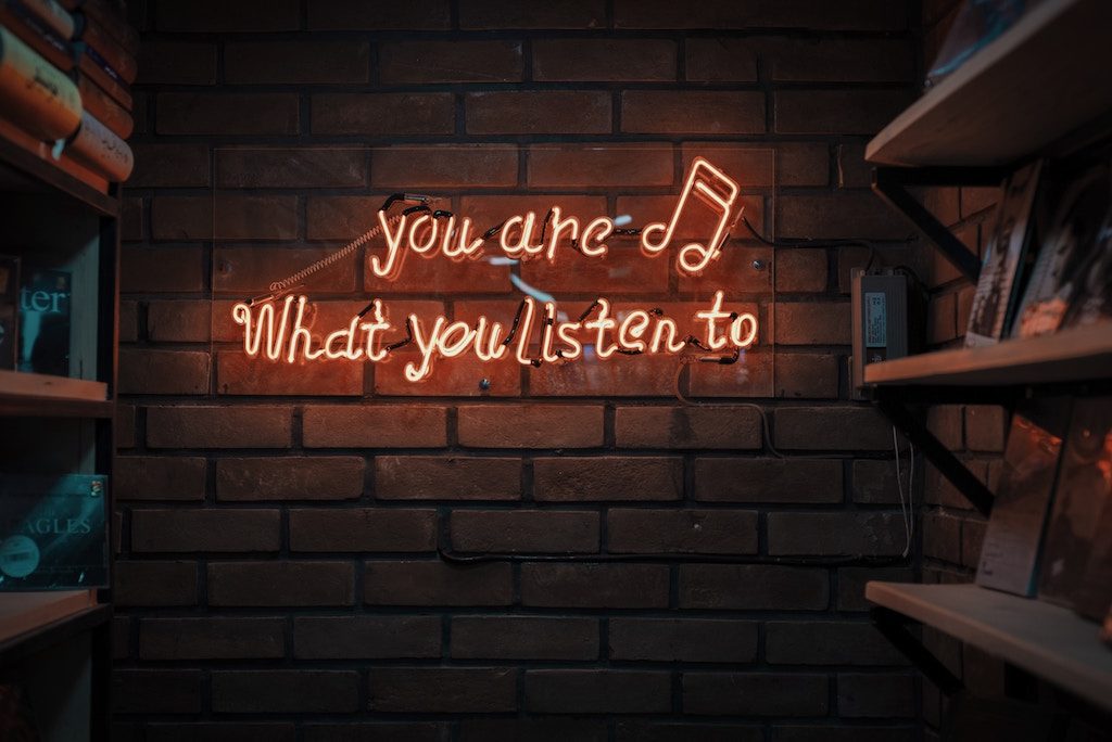 Wall with a quote "You are what you listen to" | Executive Coaching | Executive coach